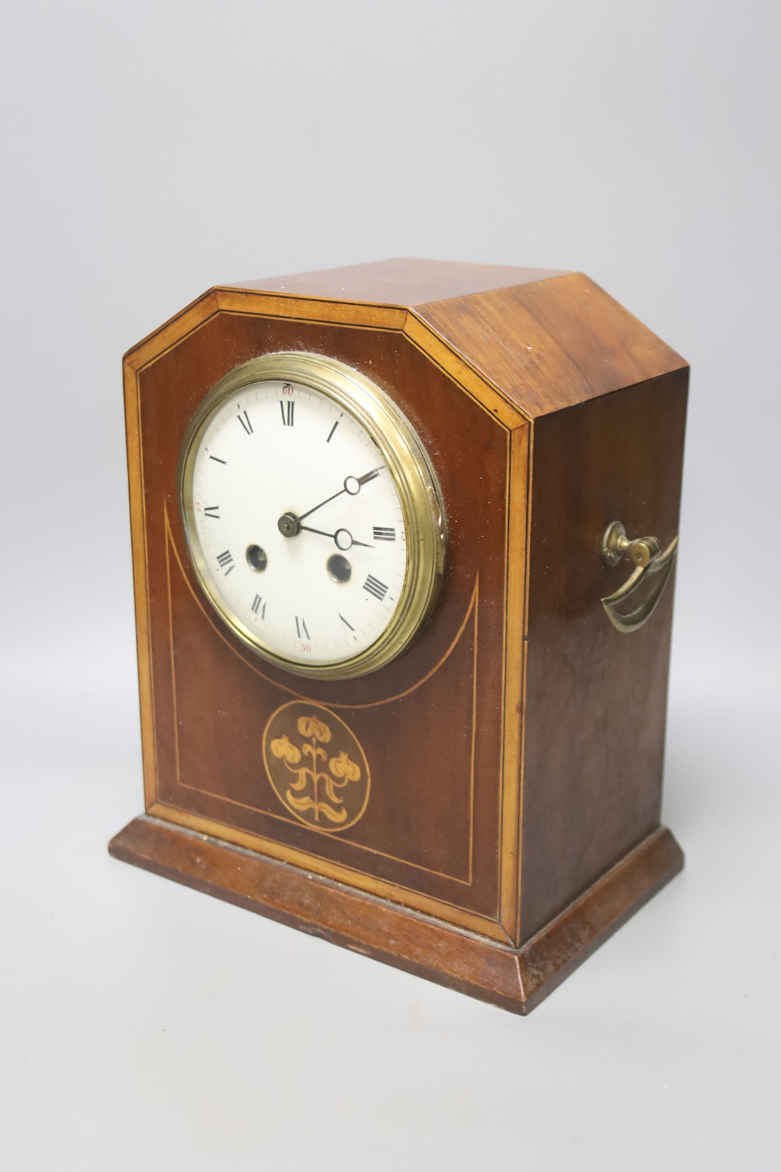 An incomplete late 19th century brass mystery timepiece, a painted wall bracket and an inlaid mahogany mantel clock